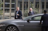 United Kingdom's Brexit advisor David Frost, left, and British Ambassador to the EU Tim Barrow, center, arrive at EU headquarters for a technical meeting on Brexit in Brussels, Wednesday, Sept. 11, 2019. (AP Photo/Virginia Mayo)