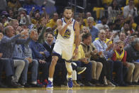 Golden State Warriors guard Stephen Curry reacts after scoring against the Dallas Mavericks during the first half of Game 2 of the NBA basketball playoffs Western Conference finals in San Francisco, Friday, May 20, 2022. (AP Photo/Jed Jacobsohn)