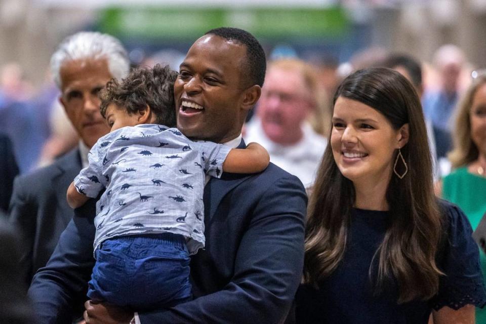 Kentucky Attorney General Daniel Cameron, with his wife Makenze and son Theodore, attends the 59th Annual Country Ham Breakfast at the Kentucky Exposition Center in Louisville, Ky., on Thursday, Aug. 24, 2023.