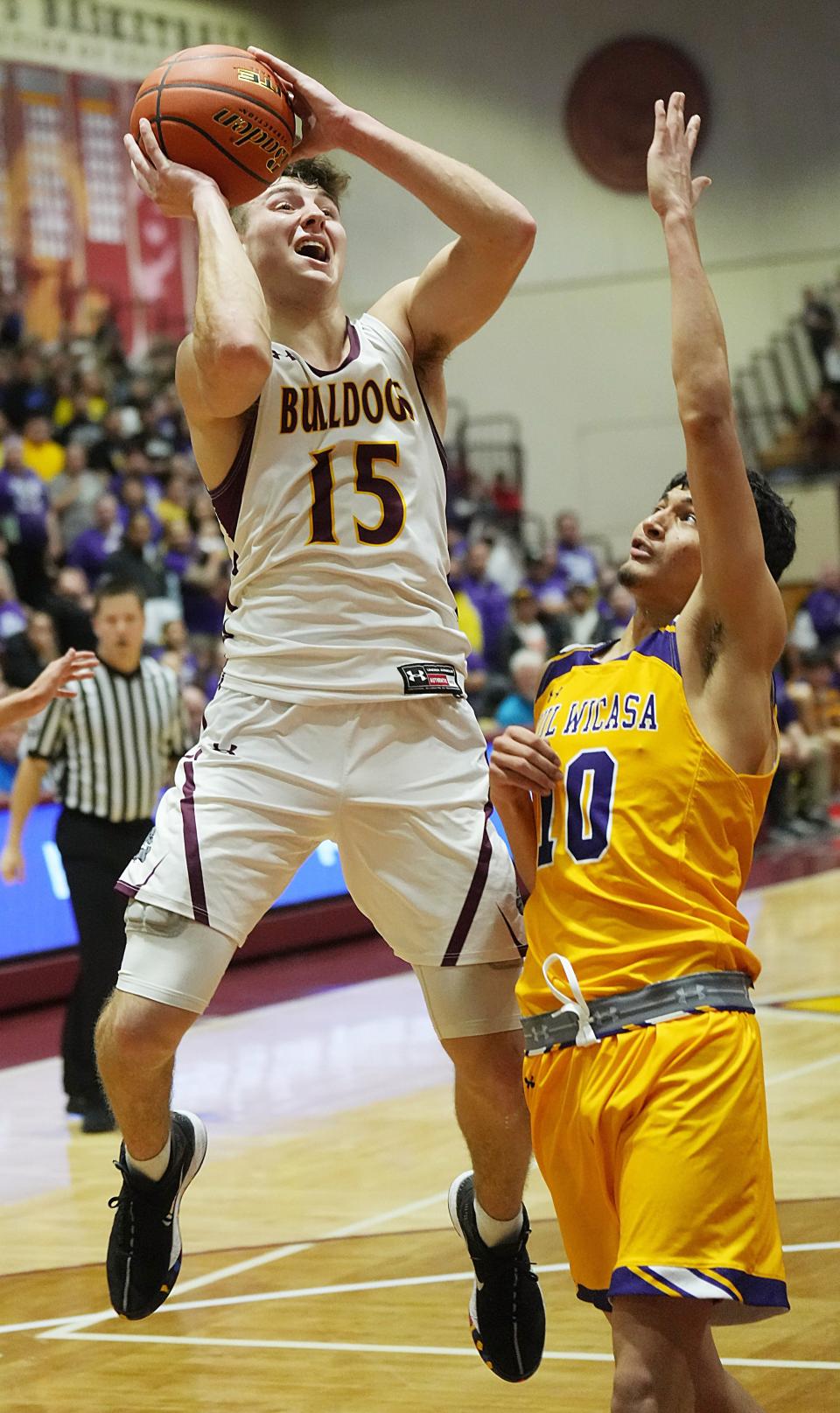 Kalen Garry of De Smet puts up a shot over a Lower Brule player in the championship game of the 2022 state Class B boys basketball tournament at Aberdeen. De Smet won 49-26 to cap a 25-1 season with a state championship for the second-straight year.