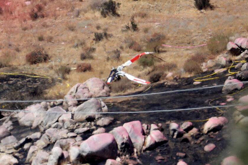 CABAZON, CA - AUGUST 07: Riverside County Fire officials say three men died when two firefighting helicopters collided in mid-air near Pipeline Road and Apache Trail. One helicopter landed safely but a Sikorsky Skycrane with three men on board went down while fighting the Broadway brush fire near Cabazon on Monday, Aug. 7, 2023 in Cabazon, CA. (Gary Coronado / Los Angeles Times)