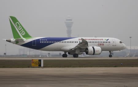 China's home-grown C919 passenger jet lands during its first flight at Pudong International Airport in Shanghai, Friday, May 5, 2017. China Daily/via REUTERS