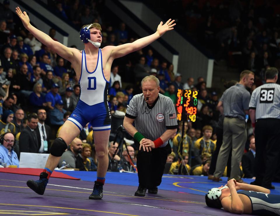 Stoney Buell of Dundee shows victory after pinning Alec Ziza of Richmond in the Division 3 State Final 2018 at Wings Event Center in Kalamazoo.