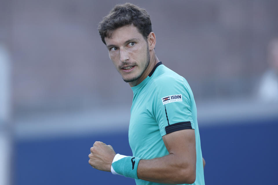 Seen here, Pablo Carreno Busta reacts to a point against Alex de Minaur in their third round clash at the US Open.