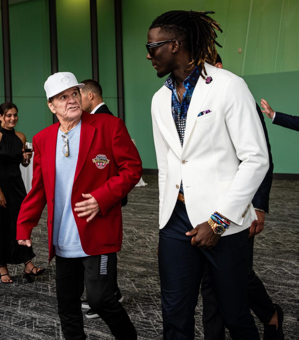 Cincinnati Reds Hall of Famer Pete Rose (left) and current infielder Elly De La Cruz (right) enter the Reds Hall of Fame Induction Gala at Duke Energy Convention Center on Sunday, July 16, 2023.