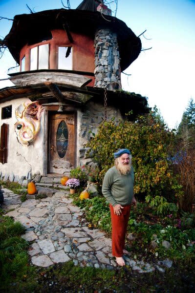 SunRay Kelley stands in front of his Washington State home.