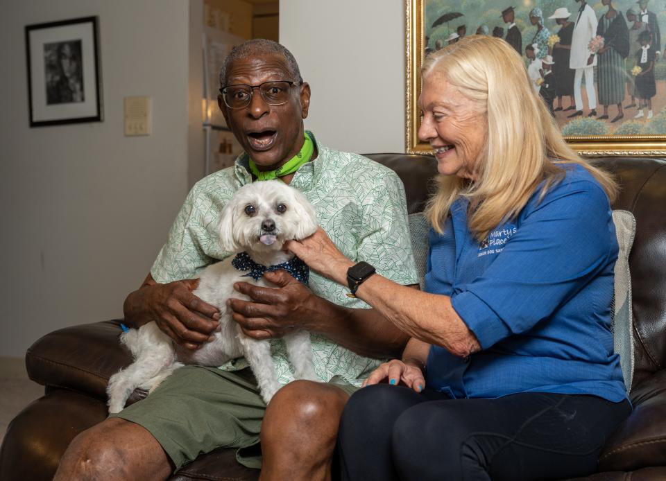 Max Hill Jr. with Prada, his 15-year-old Maltese mix with a heart condition, and Marty's Place Senior Pet Assistance Program Coordinator Debbie Williamson.