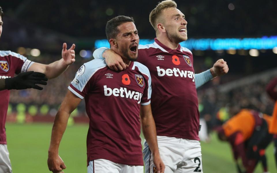 Pablo Fornals celebrates with Jarrod Bowen after scoring for West Ham against Liverpool earlier this season - GETTY IMAGES