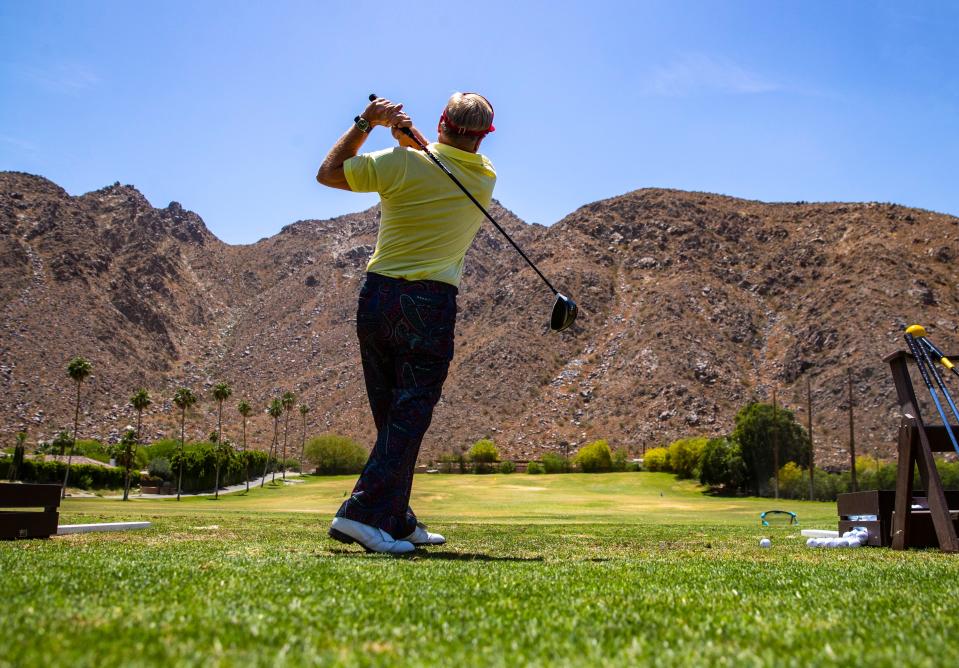 Tracy Taylor of Oceanside gets some shots in on the driving range before the start of the 16th annual Nation Desert Classic at Indian Wells Country Club in Indian Wells, Calif., Saturday, May 4, 2024.