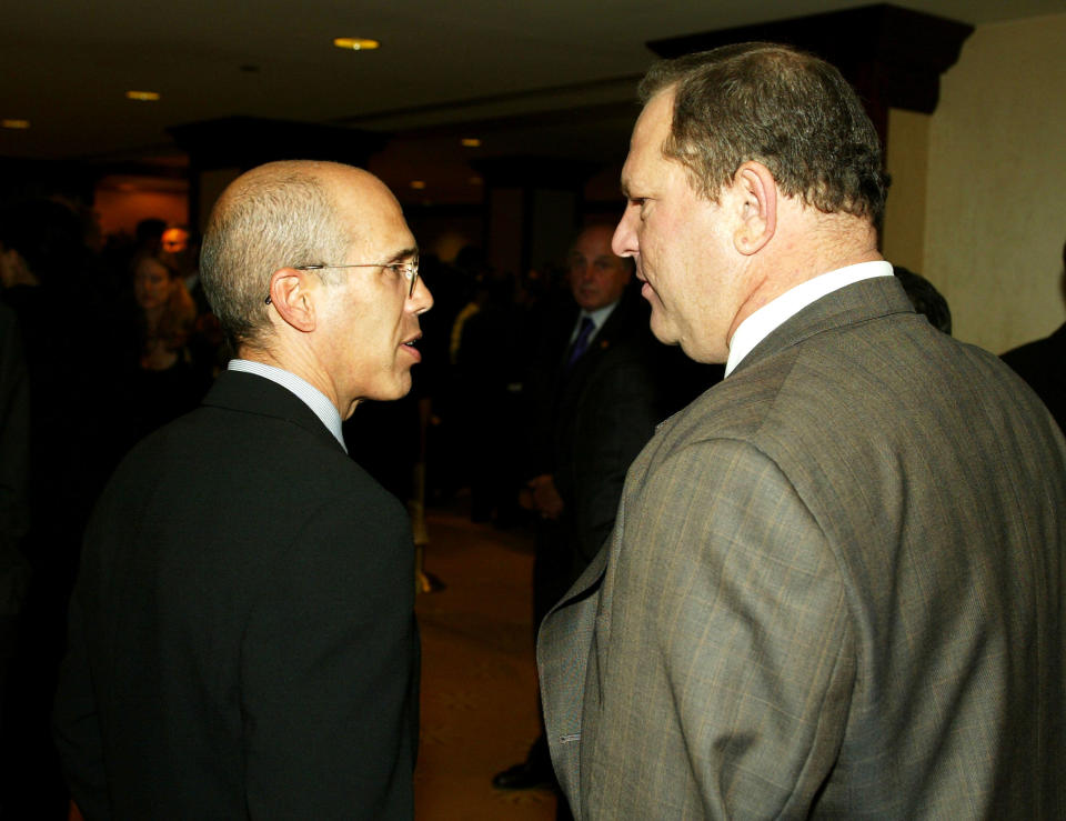 Jeffrey Katzenberg and Harvey Weinstein talk at a charity dinner on Sept. 25, 2003. (Photo: Kevin Winter via Getty Images)