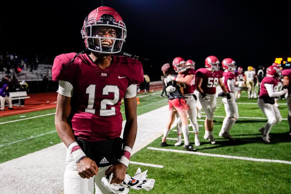 MBA’s Marcel Reed (12) reacts after defeating Christian Brothers in a Division II Class AAA semifinal game at Montgomery Bell Academy in Nashville, Tenn., Friday, Nov. 19, 2021.