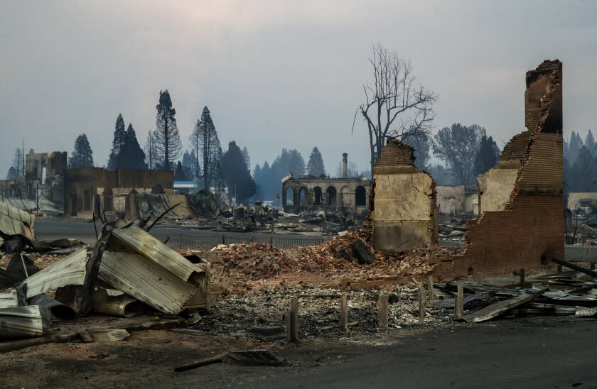 GREENVILLE, CA - AUGUST 08, 2021: The Sincerity Lodge, foreground, on Main St. in Greenville was destroyed by the Dixie Fire. (Mel Melcon / Los Angeles Times)