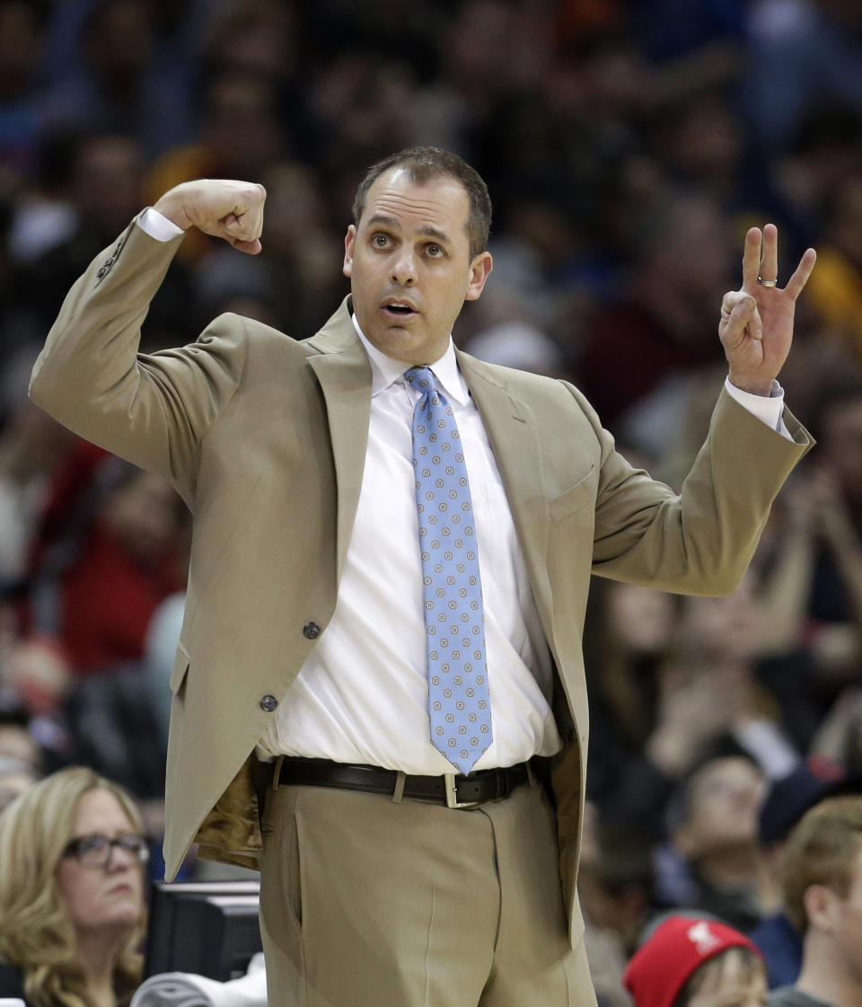 Indiana Pacers head coach Frank Vogel makes a sign for his team during the third quarter of an NBA basketball game against the Cleveland Cavaliers Sunday, March 30, 2014, in Cleveland. Cleveland defeated Indiana 90-76. (AP Photo/Tony Dejak)