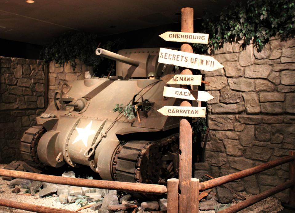 An M4 Sherman Tank crashing through wall as part of the WWII exhibit.