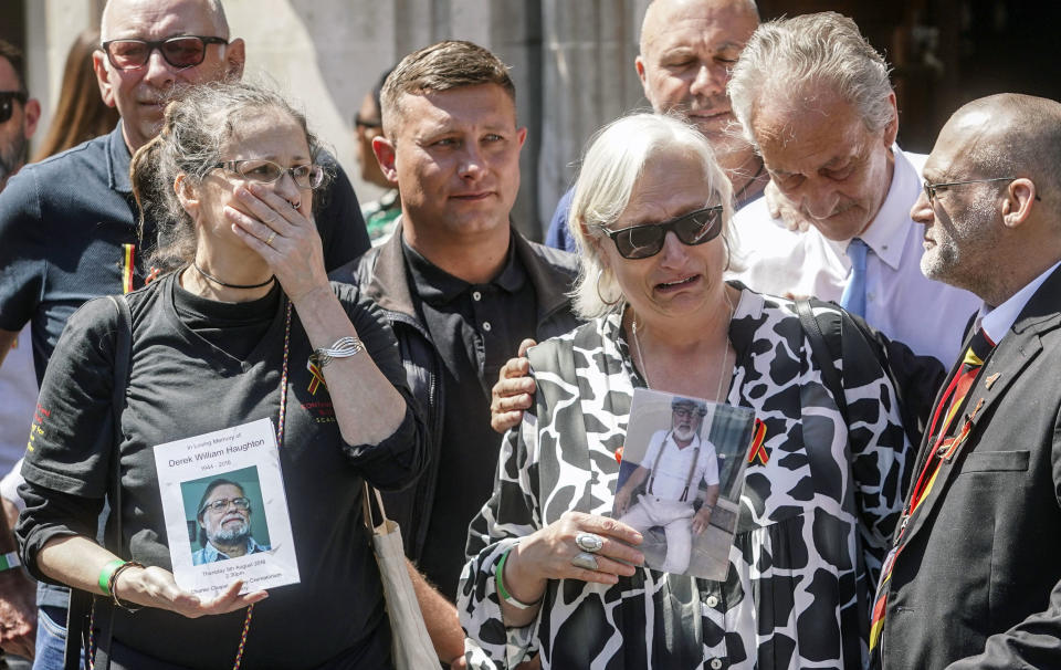 Cressida Haughton, left, who's father Derek and Deborah Dennis who's father Dennis died, gather outside the Central Hall in Westminster in London, after the publication of the Infected Blood Inquiry report, Monday May 20, 2024. British authorities and the country's public health service knowingly exposed tens of thousands of patients to deadly infections through contaminated blood and blood products, and hid the truth about the disaster for decades, an inquiry into the U.K.’s infected blood scandal found Monday. (Jeff Moore/PA via AP)