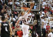 Portland Trail Blazers center Mason Plumlee (24) grabs a rebound over Los Angeles Clippers center DeAndre Jordan (6) in game four of the first round of the NBA Playoffs at Moda Center at the Rose Quarter. Mandatory Credit: Jaime Valdez-USA TODAY Sports