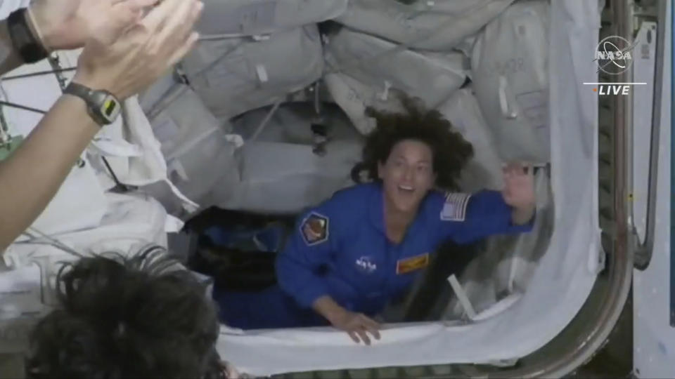 In this image from video made available by NASA, U.S. Marine Col. Nicole Mann, a member of the Wailacki of the Round Valley Indian Tribes in California, enters the International Space Station from a SpaceX Crew Dragon capsule on Thursday, Oct. 6, 2022. Her crew of four includes the first Russian to launch from the U.S., in 20 years and the first Native American woman to orbit the Earth. (NASA via AP)