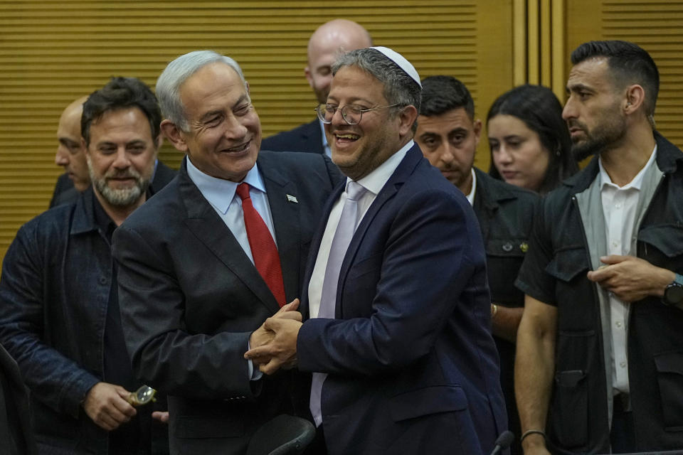 Israeli Prime Minister Benjamin Netanyahu and Israel's National Security Minister Itamar Ben-Gvir smile before Netanyahu's statement in the Knesset, Israel's parliament in Jerusalem, Tuesday, May 23, 2023. (AP Photo/Ohad Zwigenberg)