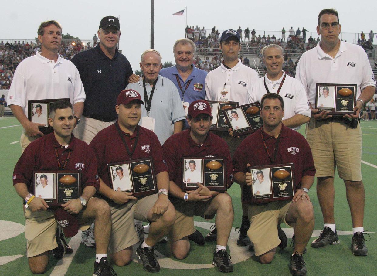 The Michael Brennan Spirit Award is given to New York City and Long Island trainers (in white and red) in 2006. Top L-R: Joseph Killeen, Boomer Esiason, Hugh Brennan, Aldo Parcesepe, Mike Wulforst, Jeffery Corben and Robert Sullivan. Bottom L-R: Chris Kalinoglu, Whittney Smith, Joseph Killeen and Jim Zegers. 