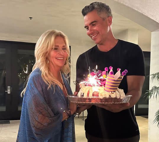 <p>jessicaalba/Instagram</p> Jessica Alba's husband Cash Warren surprises mother-in-law Cathy Alba with a birthday cake.
