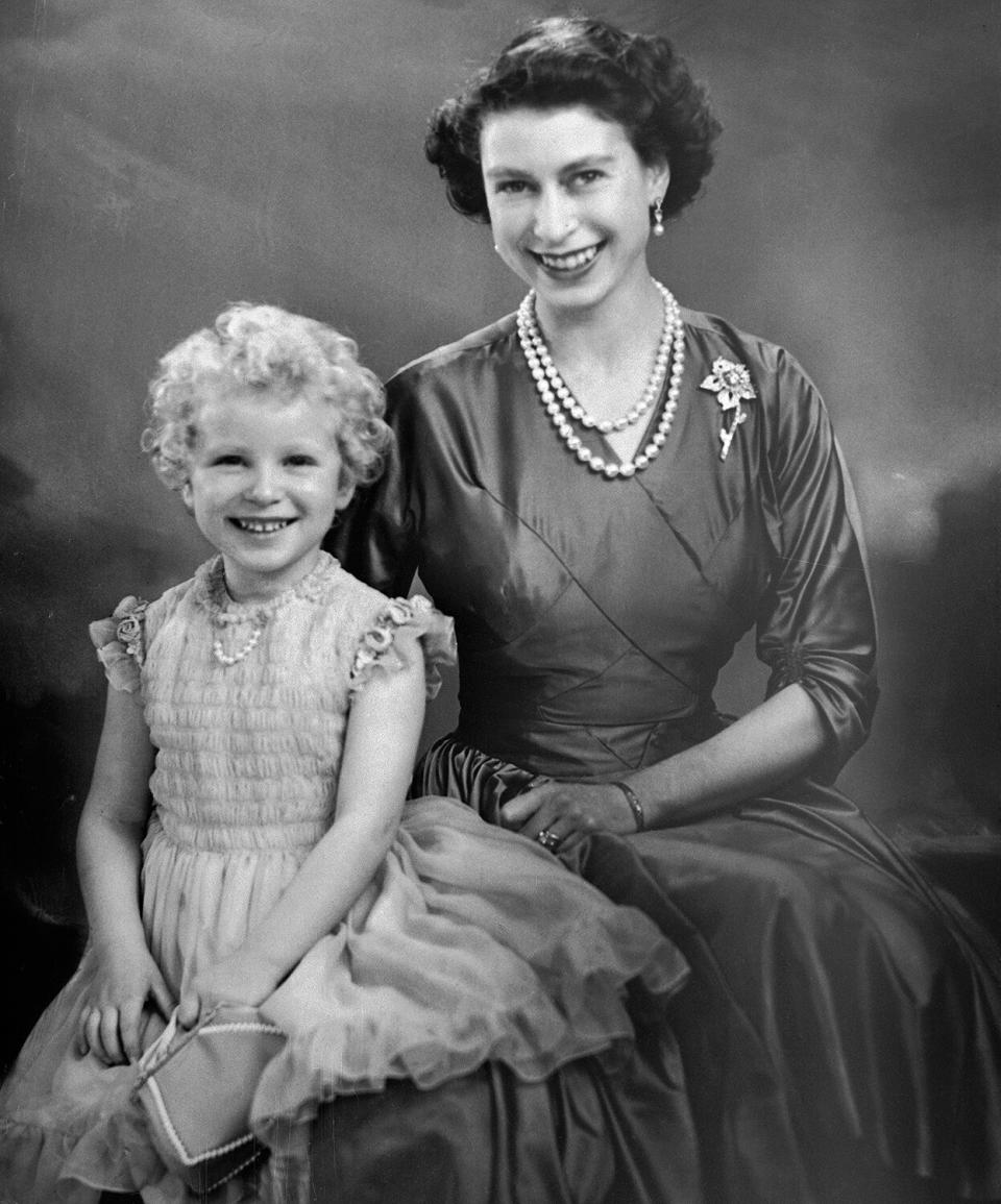 Photo shows Queen Elizabeth II as the picture of an adoring mother, posing with her daughter, Princess Anne, in this portrait.