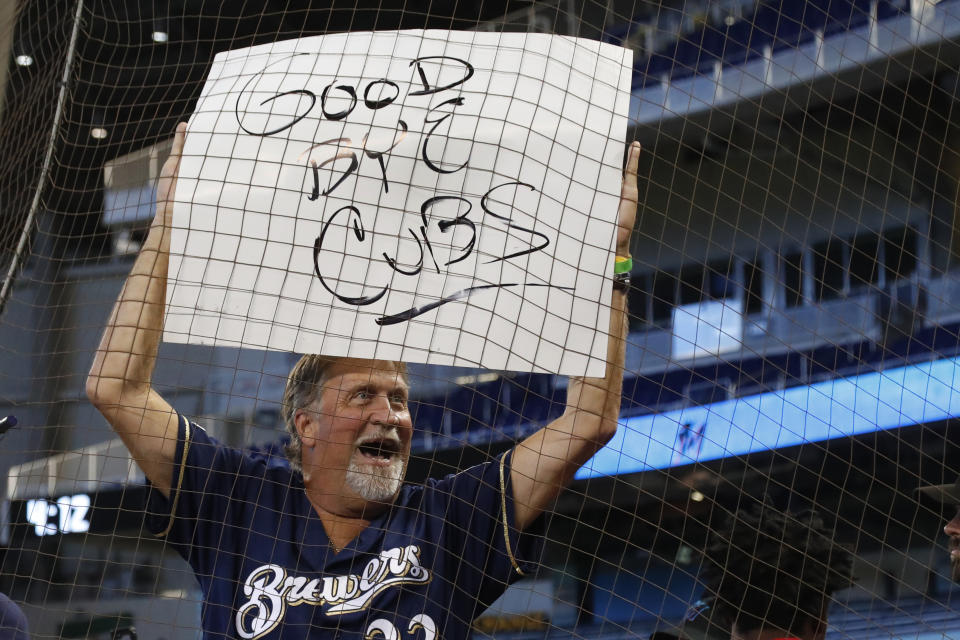 A Milwaukee Brewers fan holds up a sign after the team defeated the Miami Marlins in a baseball game Thursday, Sept. 12, 2019, in Miami. (AP Photo/Wilfredo Lee)