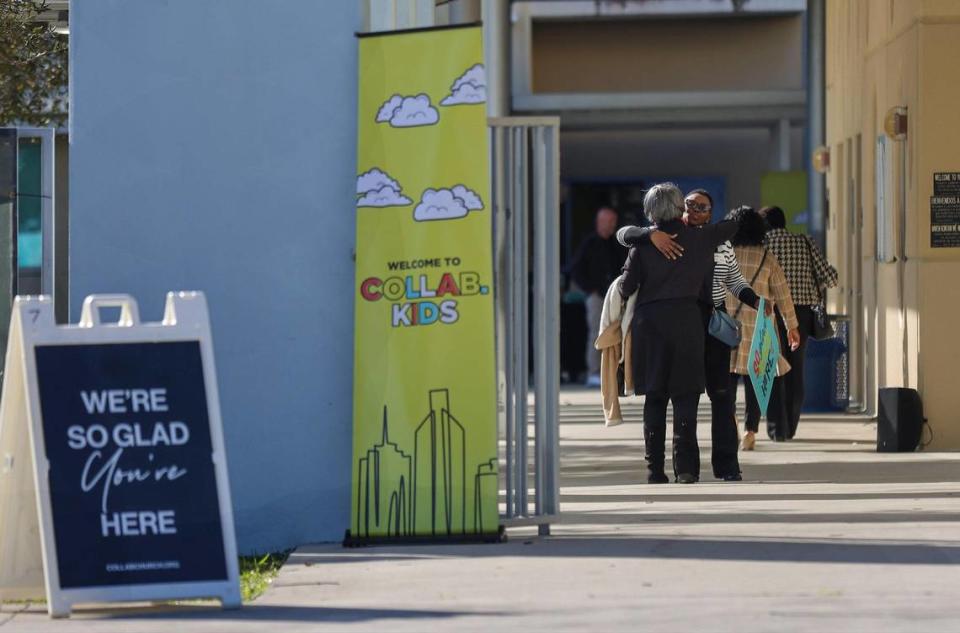 Greeter Carline Larson welcomes worshipers to Sunday service on January 21, 2024, in Miami Gardens, Florida. The Assemblies of God church sold its eight-acre property to developers in 2022, and the church rebranded to Collab.Church the same year at operates temporarily inside the auditorium of the North Dade Middle School. Carl Juste/cjuste@miamiherald.com