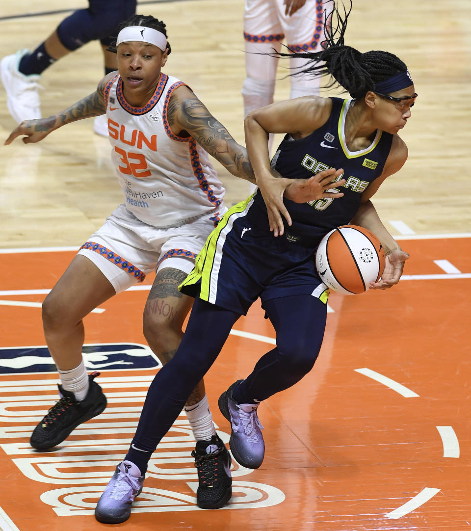 Connecticut Sun forward Emma Cannon commits the foul on Dallas Wings guard Alisha Gray during the seconds half of a WNBA basketball game Tuesday, June 22, 2021 at Mohegan Sun Arena in Uncasville, Conn. (Sean D. Elliot/The Day via AP)