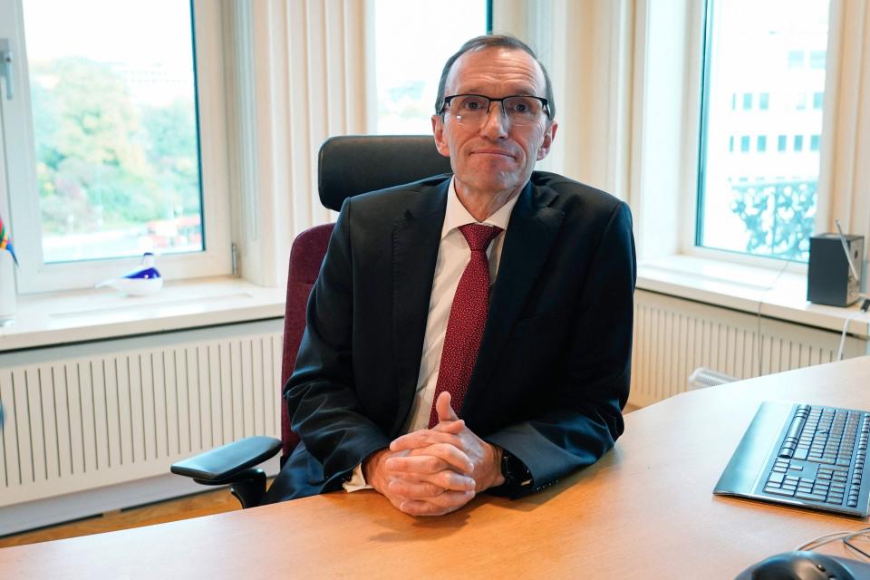Newly appointed Norwegian foreign minister Espen Barth Eide sits at his desk in Oslo (NTB/AFP via Getty Images)