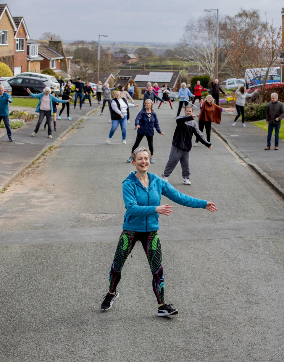 Janet Woodcock holds a social distance dancing event with the residents of Springbourne in Frodsham, Cheshire as the UK continues in lockdown to help curb the spread of the coronavirus.