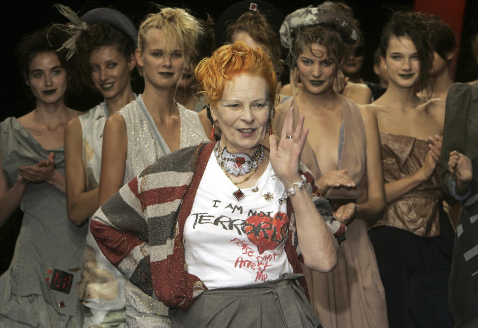 FILE - Models applaud as British fashion designer Vivienne Westwood salutes the public after the presentation of her Spring/Summer 2006 collection in Paris, Tuesday, Oct. 4, 2005. Westwood, an influential fashion maverick who played a key role in the punk movement, died Thursday, Dec. 29, 2022, at 81. (AP Photo/Michel Euler, File)