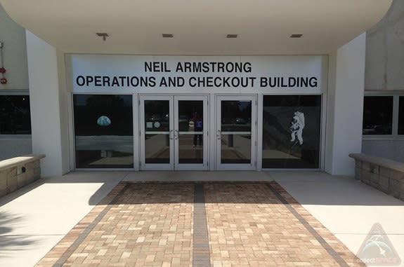 A new sign outside the entrance to the Operations and Checkout Building at NASA's Kennedy Space Center in Florida reveals the facility's new namesake, the late Apollo astronaut Neil Armstrong, ahead of a scheduled July 21, 2014 renaming ceremon