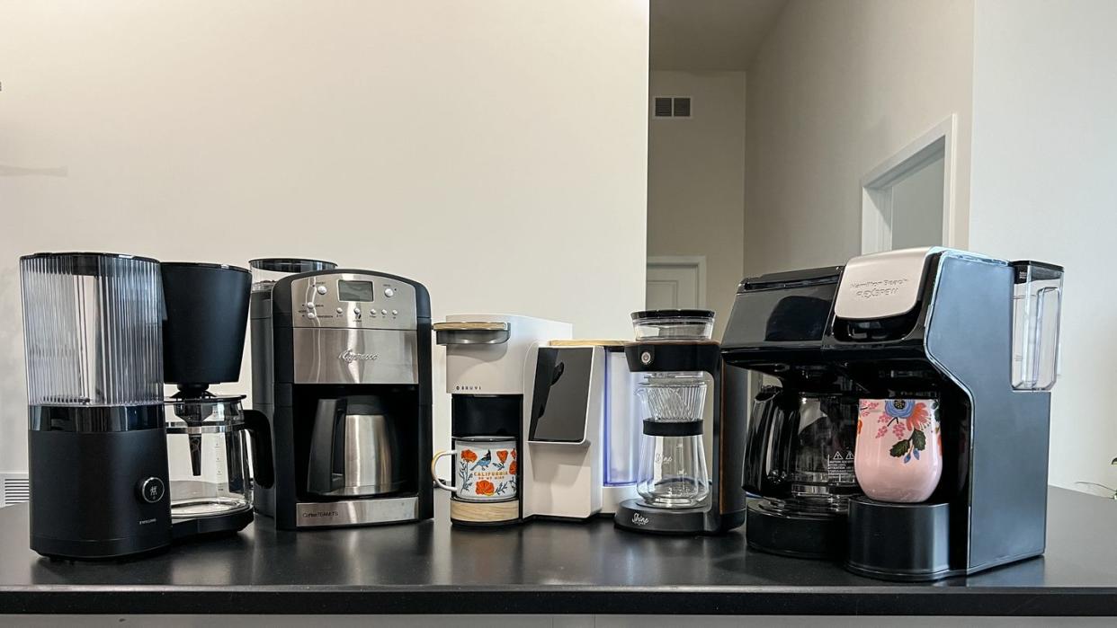 a kitchen counter with coffee makers
