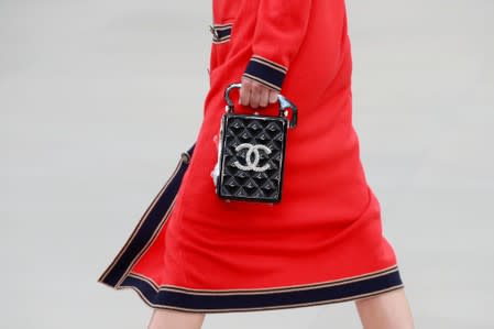 FILE PHOTO: A model presents a creation during the Cruise 2020 collection show for French fashion house Chanel at the Grand Palais in Paris, France