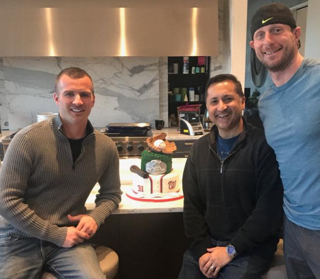 Nationals pitcher Max Scherzer (far right) and friends pose with his custom Cy Young Award cake. (Max Scherzer on Twitter)