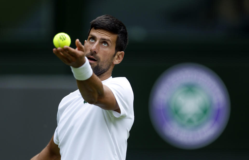 Serbia's Novak Djokovic practices on Center Court ahead of the 2022 Wimbledon Championship at the All England Lawn Tennis and Croquet Club, in London, Thursday, June 23, 2022. (Steven Paston/PA via AP)