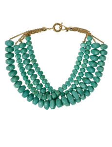 This impressive turquoise necklace supplies the right amount of heft to a simple dress.