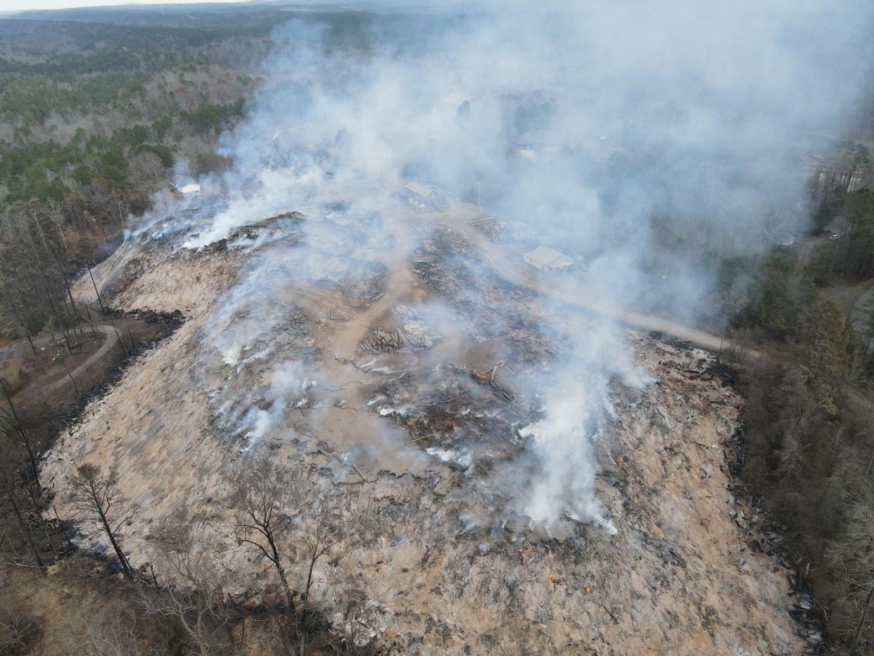 Fire burns beneath a landfill in St. Clair County, Alabama, in a photo released by Moody Fire Department on Dec. 19, 2022.