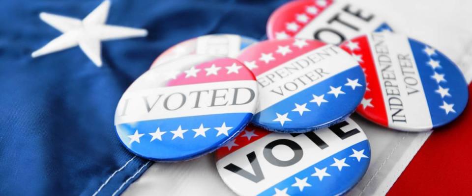 American vote badges on national flag background