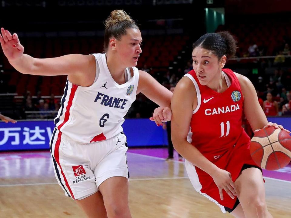 Canada's Natalie Achonwa, right, seen above in September 2022, said she's embracing the lightness of the younger players on the national basketball team ahead of its Olympic qualifier in Sopron, Hungary. (Kelly Defina/Getty Images - image credit)