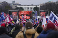 FILE - Supporters of President Donald Trump supporters attend a rally near the White House in Washington, on Jan. 6, 2021. An original script for Donald Trump’s speech the day after the Capitol insurrection included lines asking the Justice Department to “ensure all lawbreakers are prosecuted to the fullest extent of the law’ and stating the rioters “do not represent me,” but those references were deleted and never spoken, according to exhibits released by House investigators on Monday. (AP Photo/John Minchillo, File)