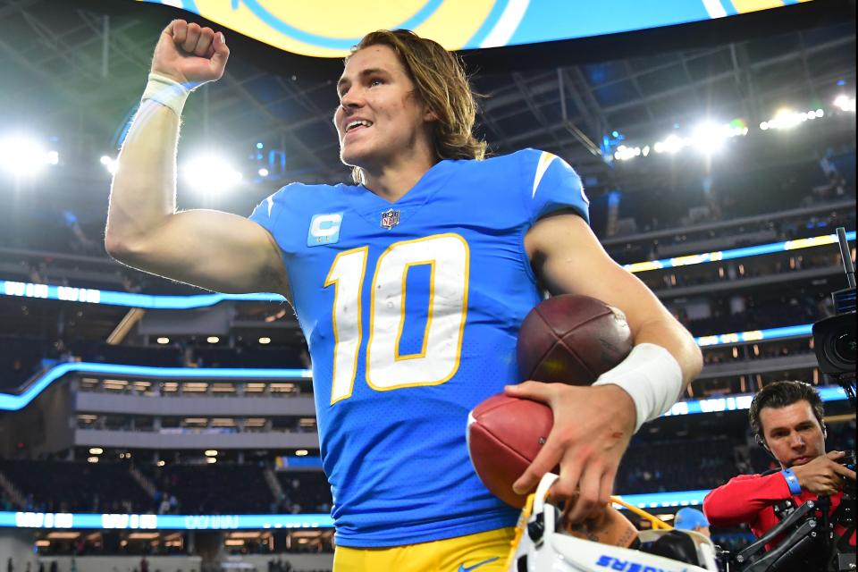 Los Angeles Chargers quarterback Justin Herbert (10) celebrates the victory against the Miami Dolphins at SoFi Stadium.