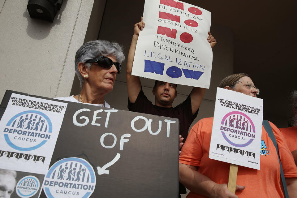 <p>Activists Silvia Munoz, Santiago Beck and Jeanne Conlin, left to right, outside the office of Sen. Bill Nelson as they ask for his support for Deferred Action for Childhood Arrivals who are people who were brought to this country illegally as children — also known as Dreamers — on Jan. 10, 2018, in Coral Gables, Fla. Sen. Nelson voted in December for a temporary budget that didn’t include a solution for Dreamers; the activists want him to vote against any spending bill that does not include a “clean” Dream Act. (Photo: Joe Raedle/Getty Images) </p>