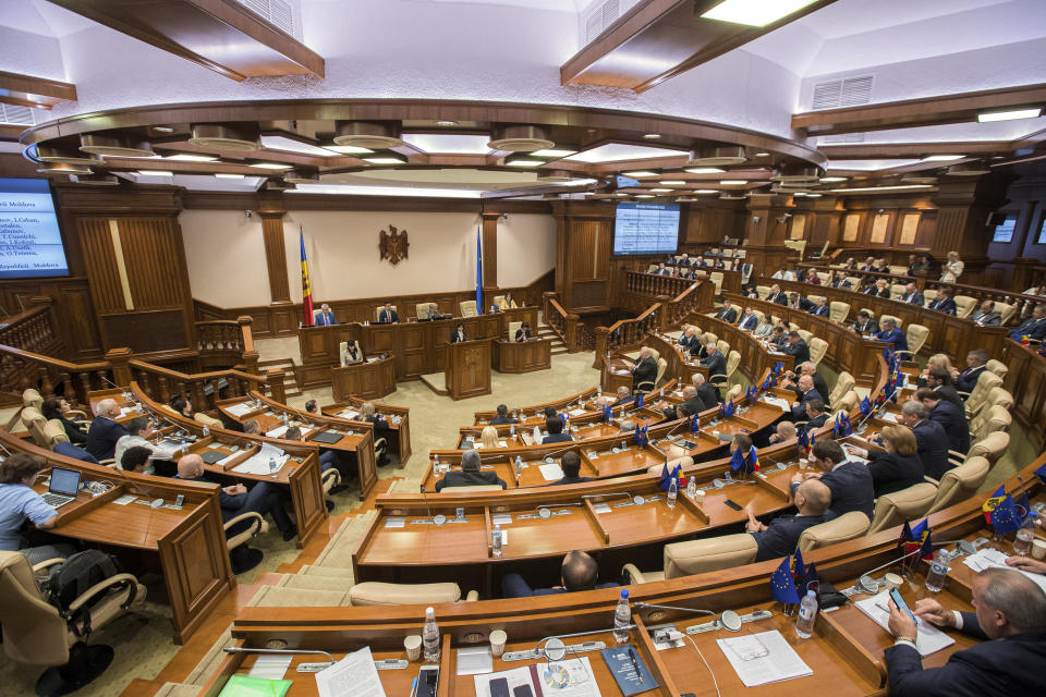 Moldova's Premier Maia Sandu addresses members of parliament during a no-confidence motion against her government in Chisinau, Moldova, Tuesday, Nov. 12, 2019. Prime Minister Maia Sandu's government coalition between a pro-European group and a Russian-backed party has fallen after losing a no-confidence vote in parliament as 63 of 101 lawmakers supported the no-confidence motion. (AP Photo/Roveliu Buga)