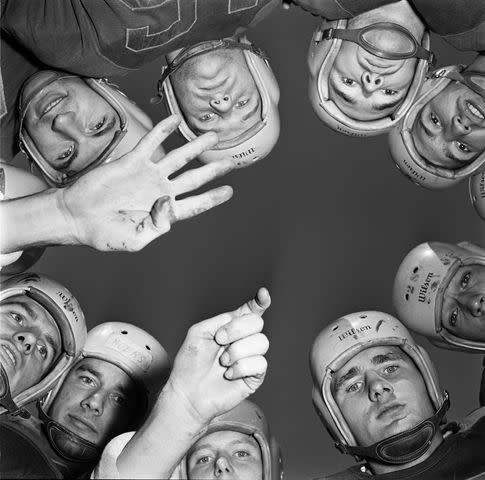 <p>Douglas Grundy/Three Lions/Hulton Archive/Getty</p> A football team huddles before play at Gallaudet College for deaf students in Washington, D.C., circa 1955