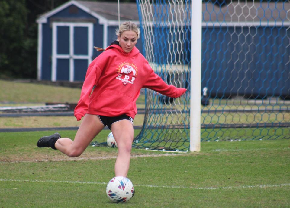 St. Johns Country Day forward Sydney Schmidt strikes the ball during a high school girls soccer practice on Friday.