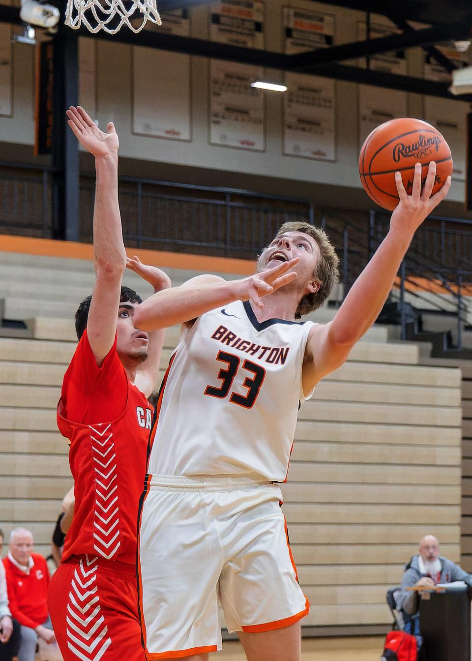 Brighton's Ben Anderson, who scored a career-high 17 points, take a shot while defended by Canton's Omar Suleiman during the Bulldogs' 69-52 victory Tuesday, Jan. 24, 2023.