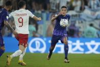 Argentina's Guido Rodriguez goes for the ball during the World Cup group C soccer match between Poland and Argentina at the Stadium 974 in Doha, Qatar, Wednesday, Nov. 30, 2022. (AP Photo/Jorge Saenz)