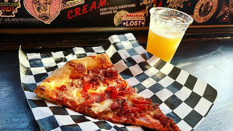 Slice of pizza and beer