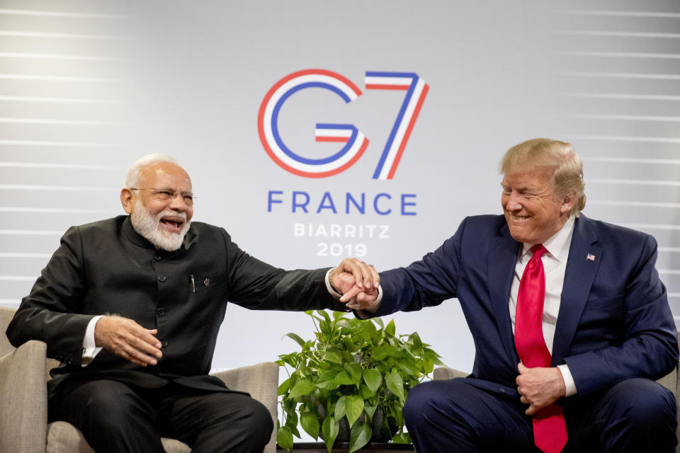 President Donald Trump and Indian Prime Minister Narendra Modi share a laugh together during a bilateral meeting at the G-7 summit in Biarritz, France, Monday, Aug. 26, 2019. (AP Photo/Andrew Harnik)